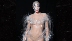 Read more about the article Julia Fox Wears Racy Nude-Colored Jumpsuit With Feathers & Face Paint